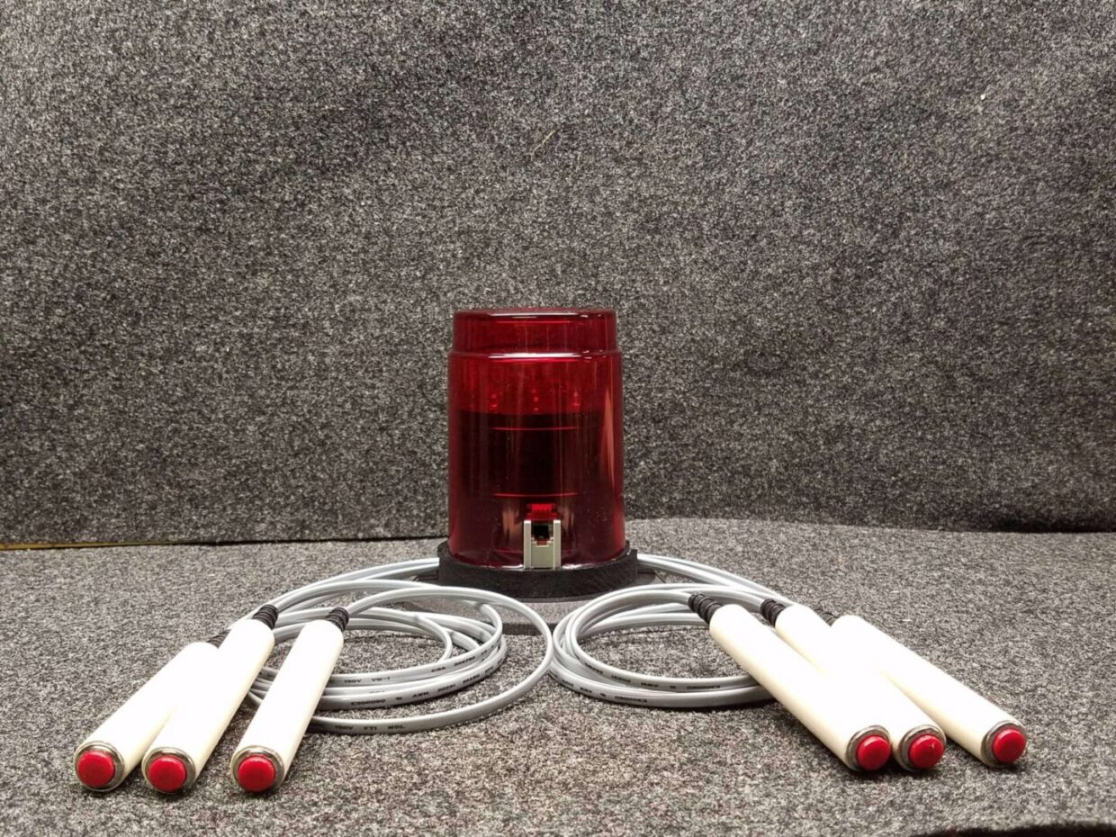 Red beacon with six attached probe leads